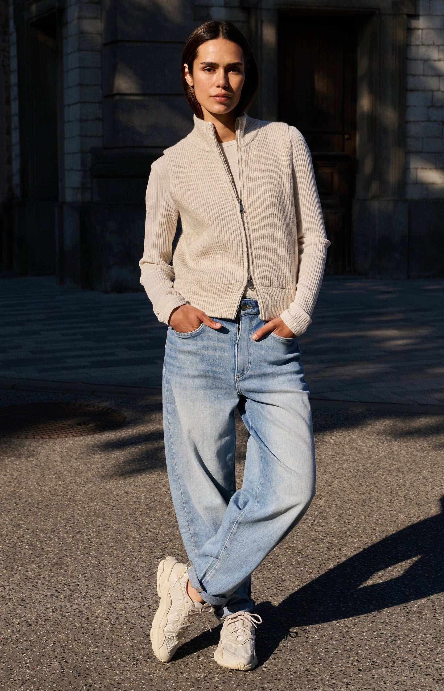 Ribbed knit sleeveless vest with high neck and zipper